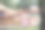 图为，身穿泰国传统服饰的女子站在木桥上拍摄人像照片。图片下载
