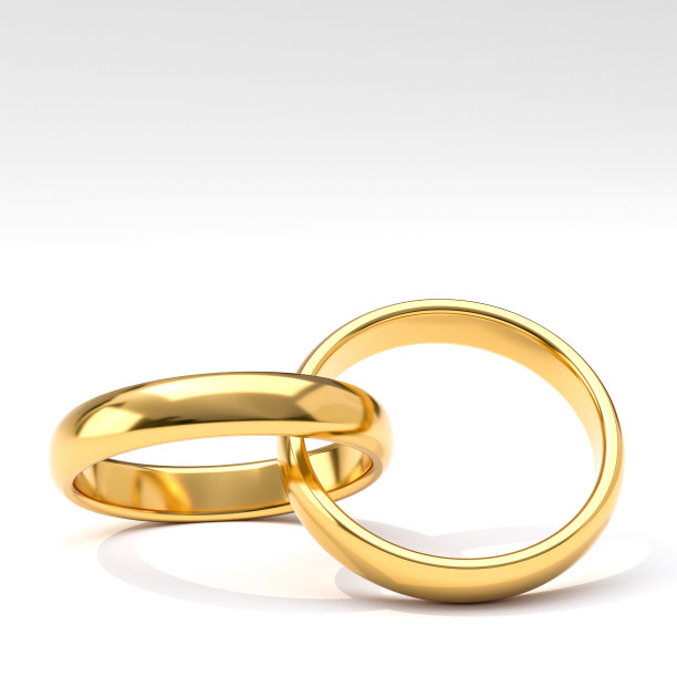 白色背景的金婚戒。图片下载