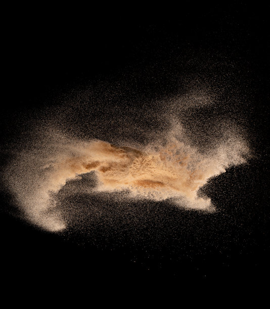 小粒细沙飞爆，金粒波爆。抽象的云飞。黄色的彩色沙在空气中飞溅二氧化硅，银河星宇宙符号符号。元素黑色背景隔离图片下载