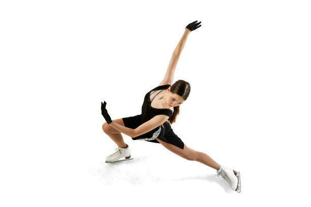年轻的少女，年轻的女子花样滑冰运动员在黑色舞台服装滑冰孤立在白色背景。前视图。艺术，技能，运动，美容，冬季运动图片下载