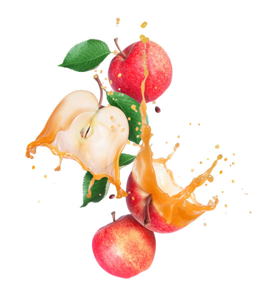 Whole and sliced ââripe apples with leaves with splashes of juice in the air图片下载