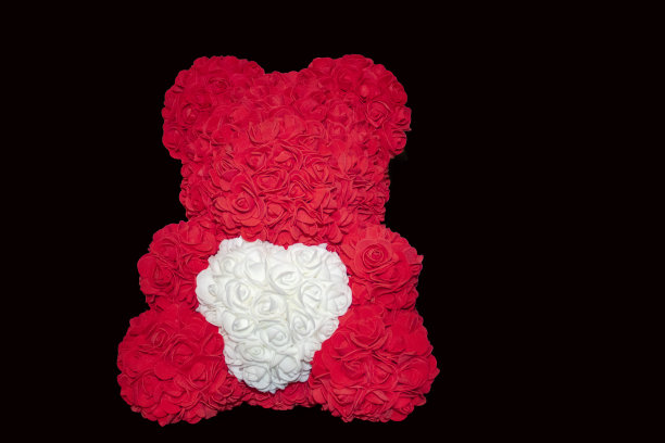 红色的玫瑰熊是情人节或女人生日的礼物图片下载