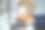 在办公室工作的亚洲商人手里拿着笔记本电脑和手机图片下载