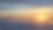 夕阳在高山上的云层上，伴随着阳光图片下载