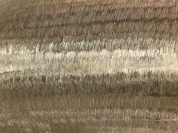 金色闪亮的抽象纹理背景。图片下载