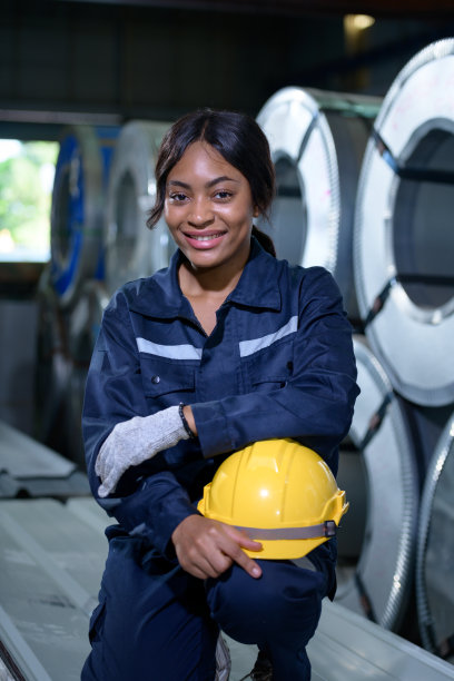 肖像的重型设备女工程师从一个巨大的行业图片下载