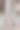 一个男人穿着米色经典裤子的运动鞋的垂直特写镜头图片下载