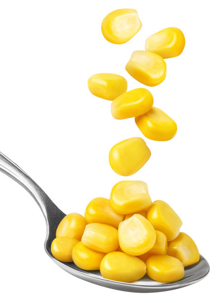 美味的玉米种子落入白色金属勺中图片下载