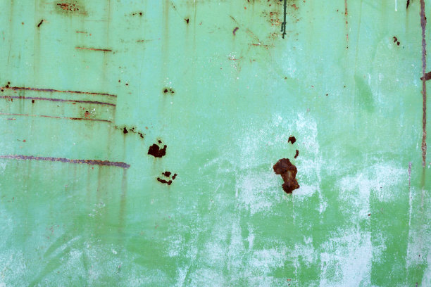 纹理老的绿色油漆是生锈的表面。垃圾背景与空间的设计图片下载