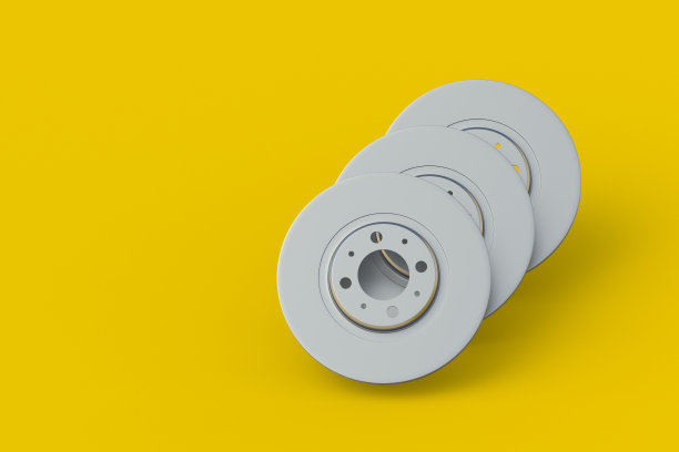 黄色背景的刹车盘。汽车服务备件。汽车零部件。副本的空间。三维渲染图片下载