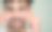 特写肖像的一个有吸引力的微笑男子手持化妆棉在他的脸颊上应用乳液孤立在粉彩背景工作室。皮肤护理保健美容程序概念图片下载