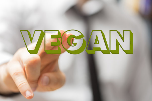 人的手显示一个绿色的插图素食文本。有机生产概念图片下载