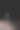 垂直特写的透明花瓶在木桌上对着黑暗的背景图片下载