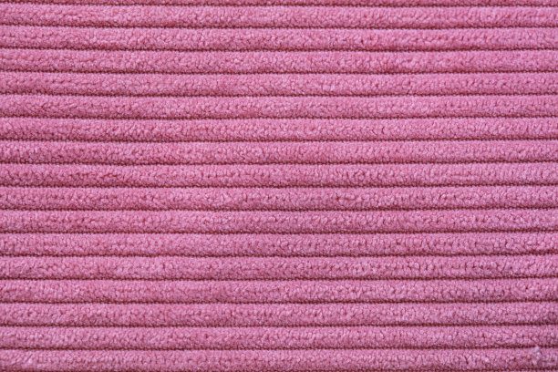 特写粉红色灯芯绒布作为图案纹理的背景图片下载