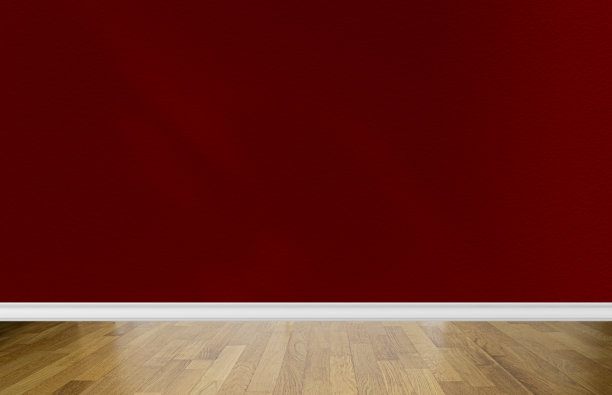 房间内部有空白的红色墙壁，抽象的阴影和松木拼花地板。文本空间图片下载