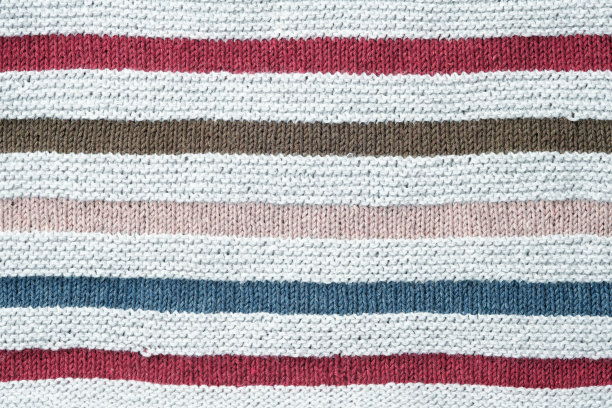 针织的背景。条纹针织棉织物的纹理接近。图片下载