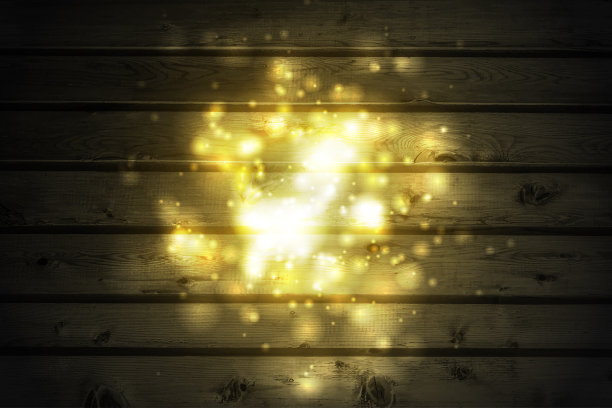 金黄色闪亮的散景灯在黑暗的木墙上图片下载