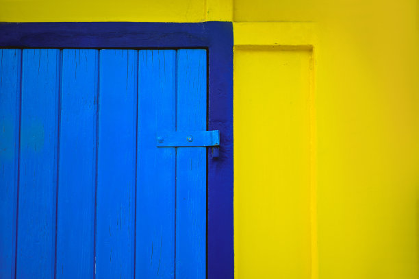 抽象的纹理，彩色的蓝色和黄色的墙壁。图片下载