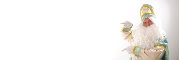 广告与手指向空间的文字横幅与白色背景的广告上的大球圣诞老人肖像荷兰圣诞老人圣尼古拉斯圣诞新年图片下载