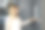 一名时尚女子正在大楼前的对讲机上按指纹。图片下载