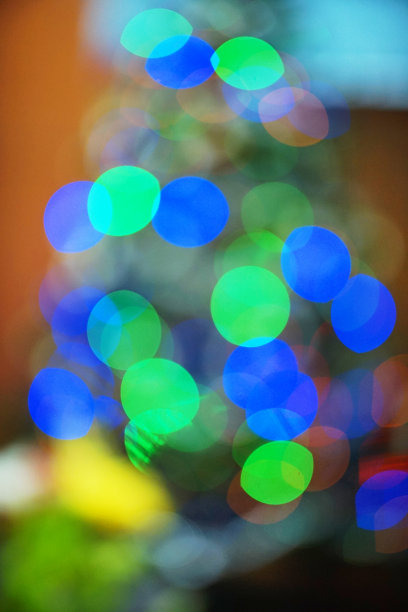 蓝色和绿色的散景球背景。图片下载