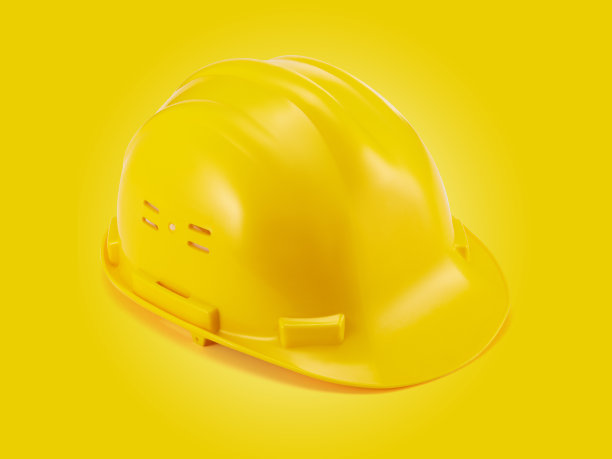 黄色背景的施工头盔图片下载