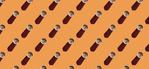 橙色粉彩背景上的咖啡杯图案图片下载