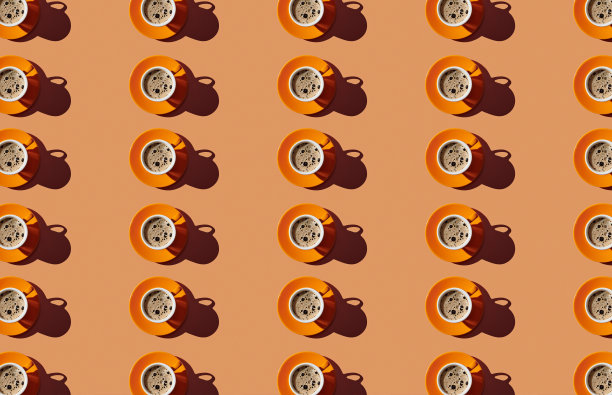 橙色粉彩背景上的咖啡杯图案图片下载