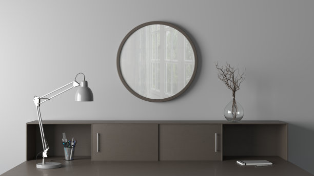 黑色木制圆形海报框架模拟在家庭工作室工作空间的白色墙壁上。前视图。图片下载