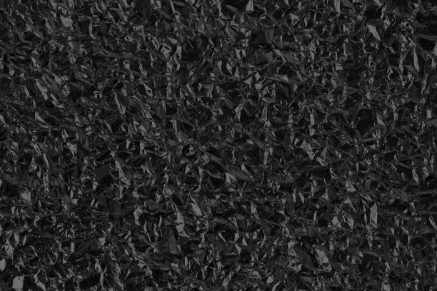 闪亮的黑色铝箔纹理背景，图案的包装纸与皱褶和波浪。图片下载