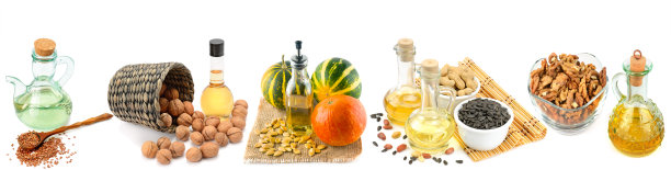 植物油，种子和坚果隔离在白色背景上。拼贴画。宽的照片。图片下载