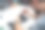 在电子修理厂，修理工用螺丝刀拆卸智能手机图片下载