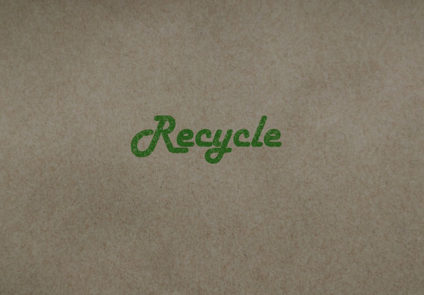 绿色的“回收”文本以棕色可回收纸为中心图片下载