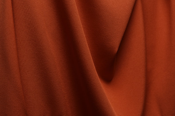 红色织物布涤纶纹理和纺织背景。图片下载