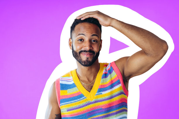 男子在彩色背景在工作室里摆姿势，穿着时髦的衣服图片下载