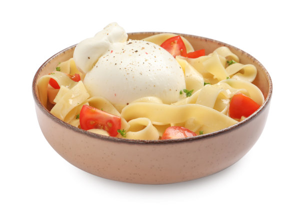 一碗美味的意大利面，上面有布拉塔干酪和番茄图片下载