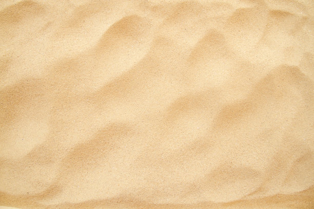 沙滩纹理背景，黄沙背景软焦点。图片下载