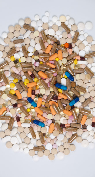 不同药丸的背景。药物、药片、胶囊、药片、维生素。药剂学概念、医学、保健、医药行业。各种各样的药。平铺，俯视图，特写图片下载
