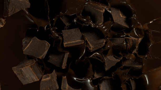 巧克力块落入黑热融化巧克力图片下载