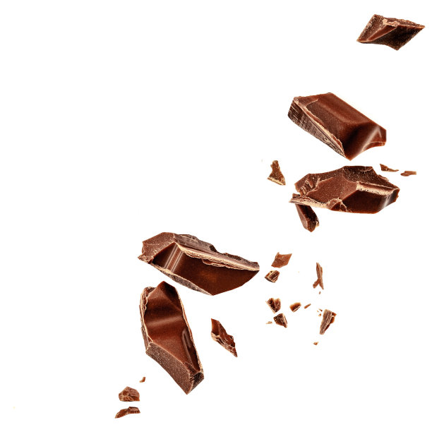  Levitating milk chocolate chunks isolated on white background. Flying Chocolate pieces, shavings and cocoa crumbs Top view. Flat lay图片下载