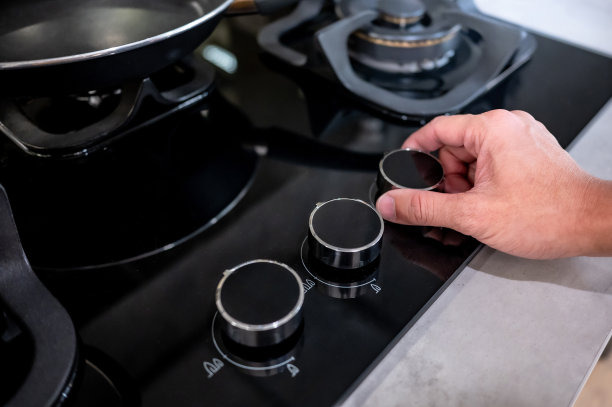 煤气炉上的公手转动开关旋钮图片下载