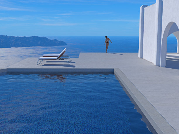 在下午的阳光下，一个穿着比基尼的女人站在一个露台的边缘，前景是一个游泳池，眺望远处的度假胜地。图片下载