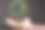 一个男性手握绿色3D星球的特写图片下载