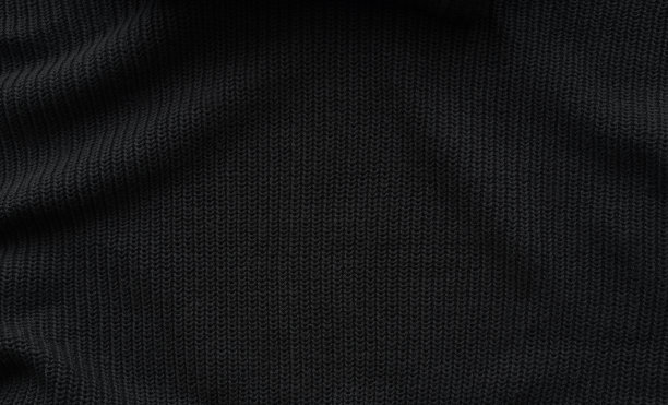 黑色针织面料纹理。摘要现代针织肌理黑色。深色针织背景图片下载