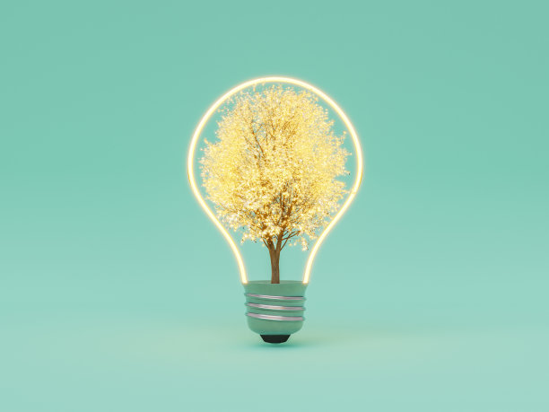 盛开的树在发光的灯泡对绿色背景图片下载