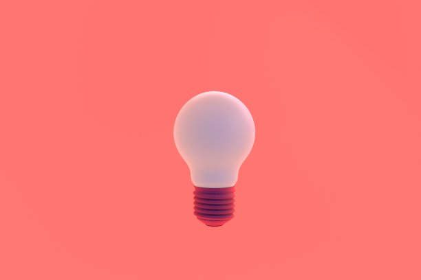 粉色背景上的灯泡。图片下载