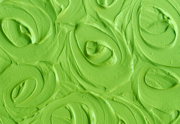 绿色美容泥(黄瓜面膜、牛油果面霜、绿茶抹茶裹身)质地贴近，选择性聚焦。抽象的背景与圆形笔触。图片下载