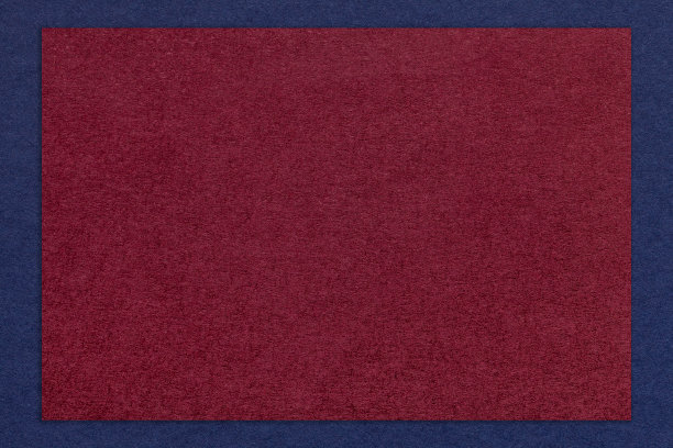 纹理工艺深酒色纸背景与海军蓝边界，宏观。复古牛皮纸红纸板图片下载