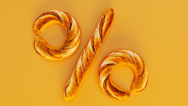 金色的法国法棍在黄色背景上形成一个百分号图片下载