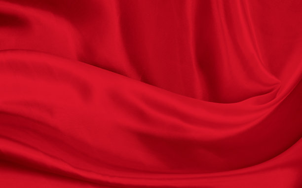 黑色红色缎面深色面料质地豪华闪亮，是抽象的丝绸布料背景与图案柔软的波浪模糊美丽。图片下载